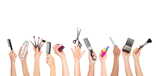 Set of hands holding tools for appearance care