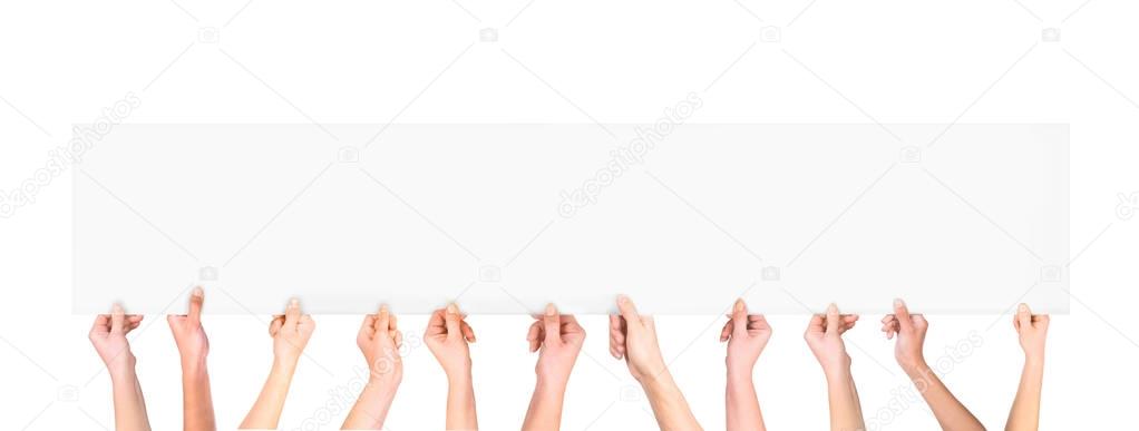 Many hands holding a blank poster for advertising on an isolated