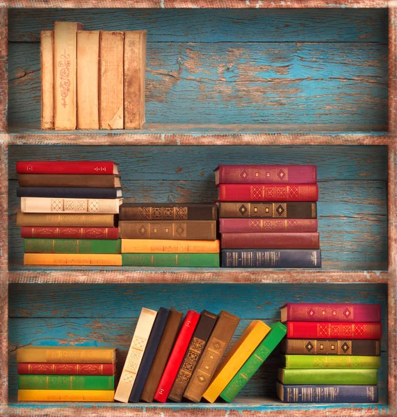 Old books on the background of a wooden — Stock Photo, Image