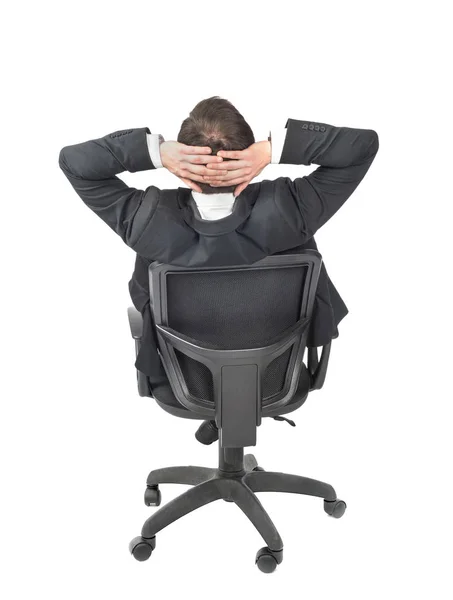 Hombre de traje sentado en una silla aislada sobre un fondo blanco —  Fotos de Stock