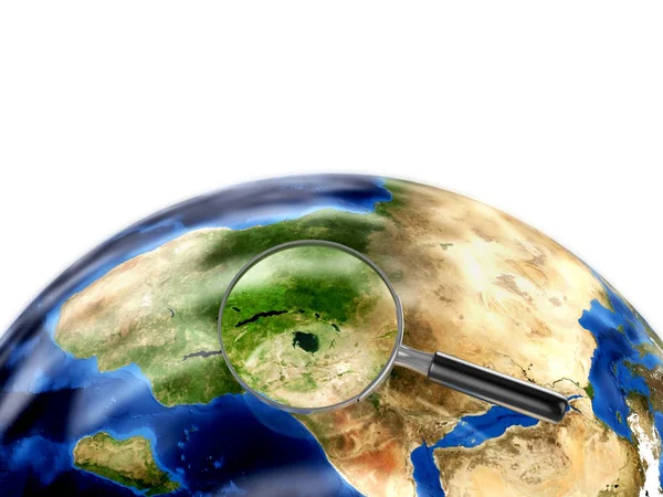 Мир земной шар и лупа — стоковое фото