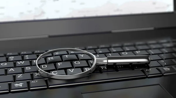 Magnifying glass on laptop computer