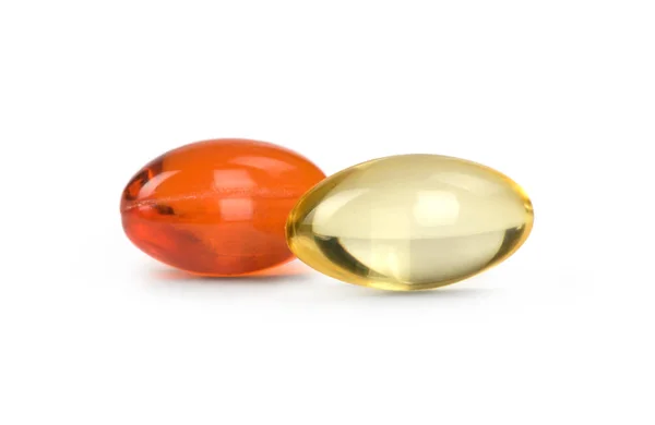 Pillole rosse e gialle isolate — Foto Stock