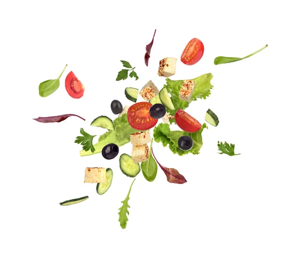 Salada voadora no fundo branco — Fotografia de Stock