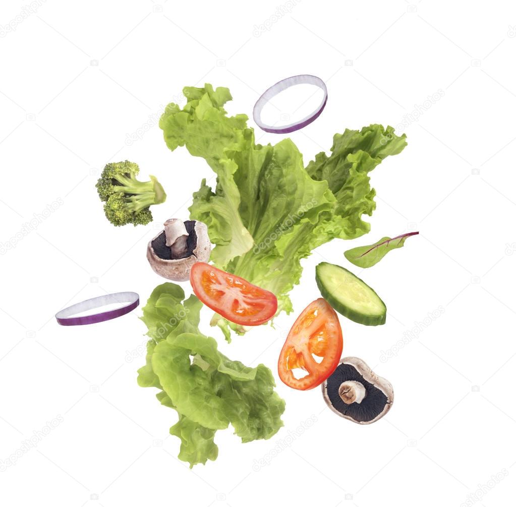 Salad flying on a white background