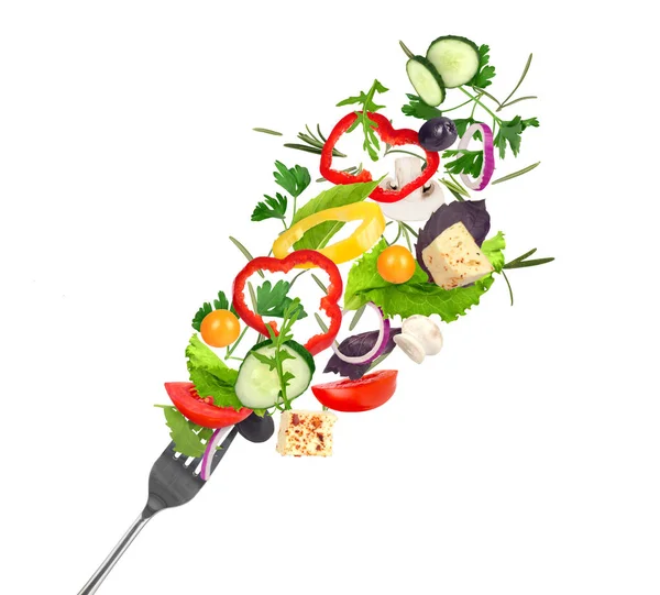 flying vegetable salad .  isolated on white background