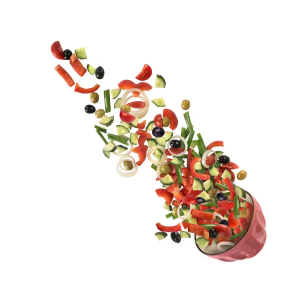 La caída de la ensalada de verduras sobre fondo blanco —  Fotos de Stock