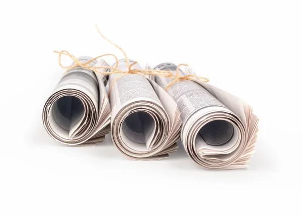 Periódicos enrollados, aislados sobre fondo blanco — Foto de Stock