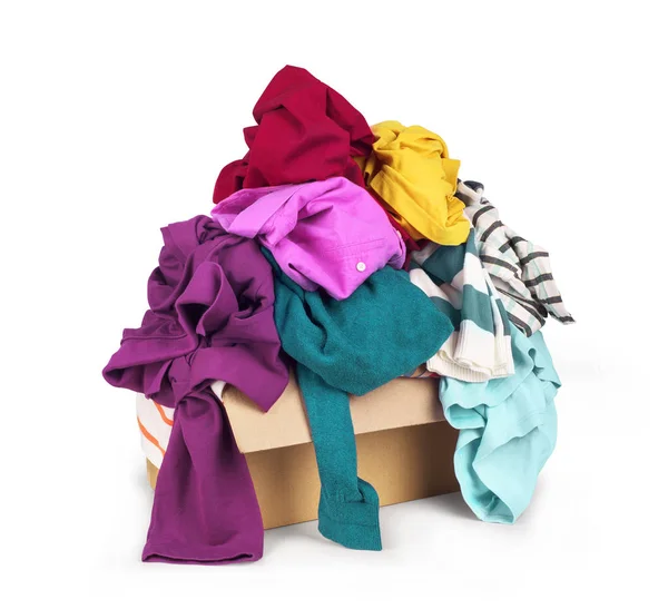 Box with clothes on white background. — Stock Photo, Image