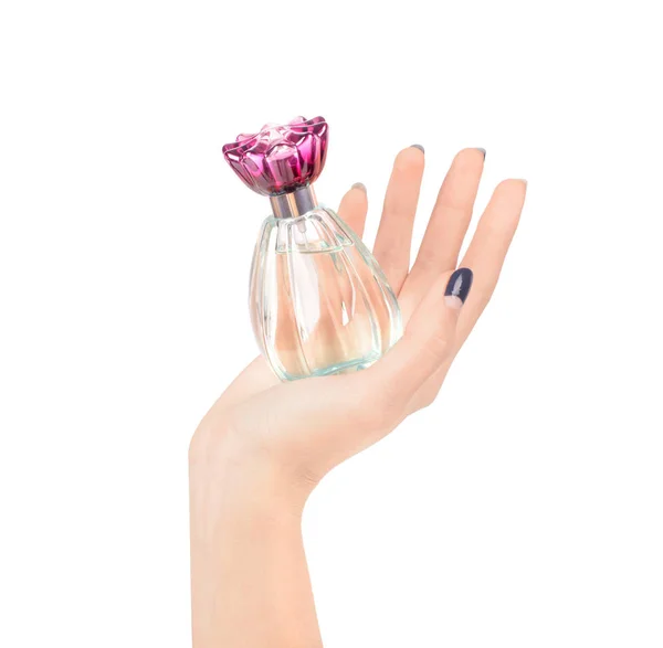 Piękne kobiece ręce, trzymając butelkę perfum na tle — Zdjęcie stockowe