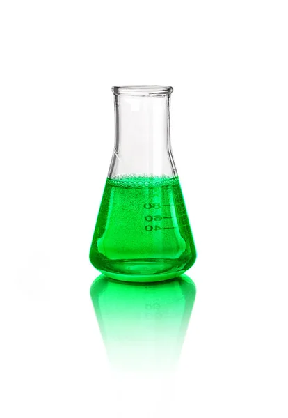 Green liquid in laboratory glassware, isolated on white background — Stock Photo, Image