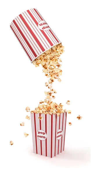 Popcorn poured from a bucket into a paper cup — Stock Photo, Image