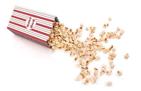 Popcorn is poured from a paper cup on a white background — Stock Photo, Image