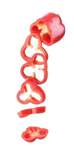 Sweet red pepper sliced and falling isolated on a white backgrou — Stock Photo, Image