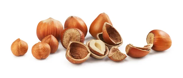 Hazelnuts on a white background. Broken hazelnuts — 스톡 사진