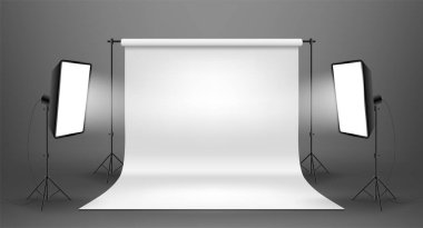 Gri arkaplanlı beyaz ekranlı fotoğraf stüdyosu