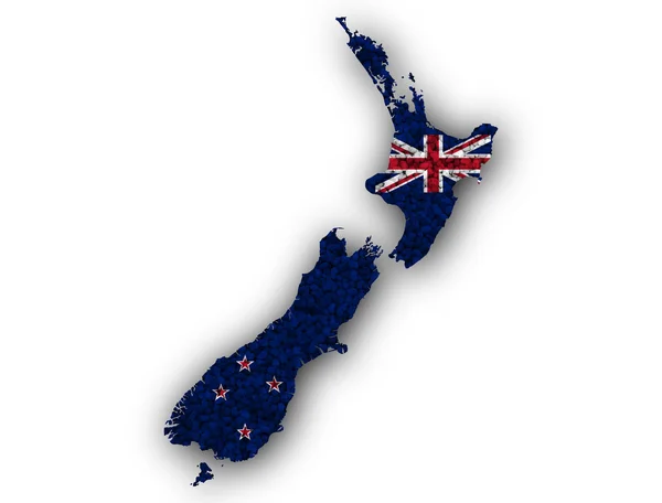 地図とケシの実でニュージーランドの旗 — ストック写真