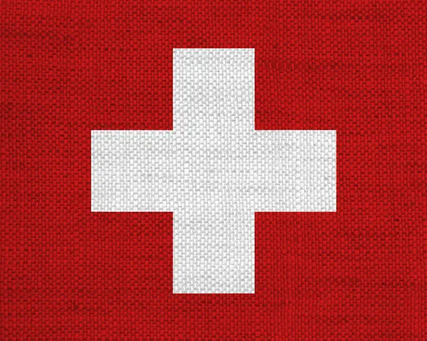 Schweiz flagga på gamla linne — Stockfoto