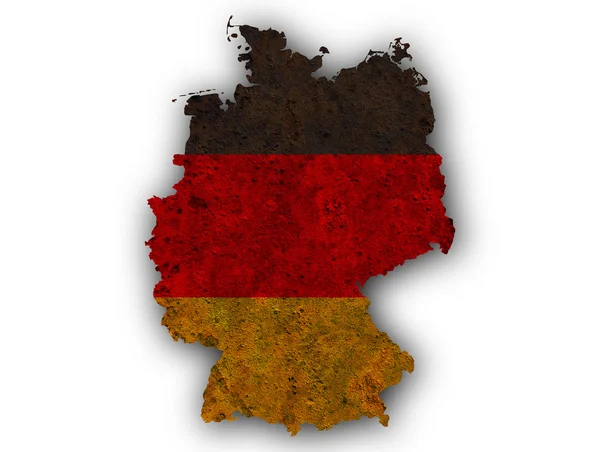 Mapa y bandera de Germnay sobre metal oxidado — Foto de Stock