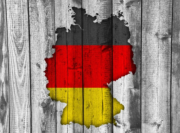 Karte und Fahne von Deutschland auf verwittertem Holz — Stockfoto