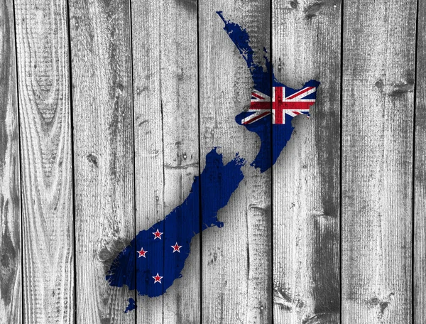 Mappa e bandiera della Nuova Zelanda su legno , — Foto Stock