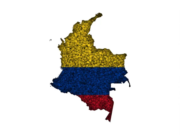 Karta och flaggan i Colombia på vallmofrön — Stockfoto
