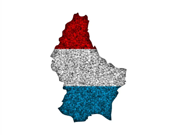 Karte und luxemburgische Flagge auf Mohn — Stockfoto
