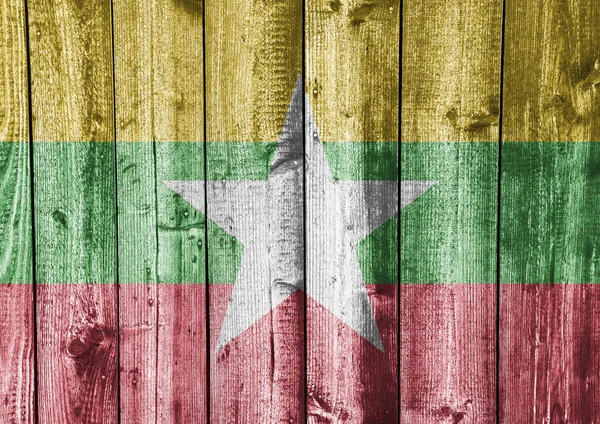 Flag of Myanmar on weathered wood — Stock Photo, Image
