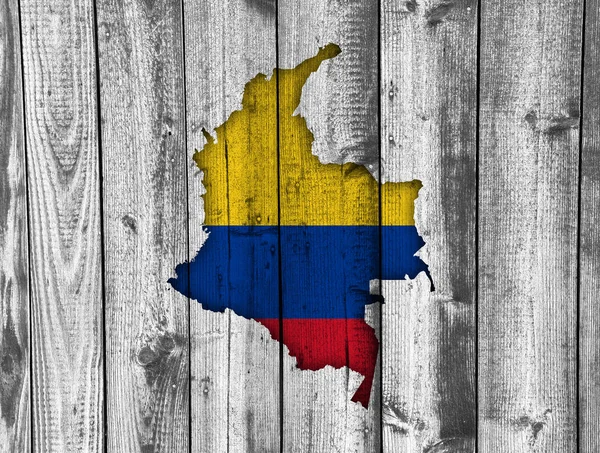 Mapa e bandeira da Colômbia em madeira intemperizada — Fotografia de Stock