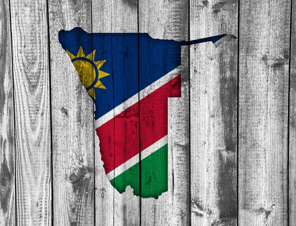 Mappa e bandiera della Namibia su legno intemperie — Foto Stock