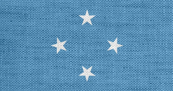 Bandera de Micronesia sobre lino viejo — Foto de Stock