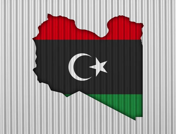 Karta och flaggan i Libyen på korrugerad — Stockfoto