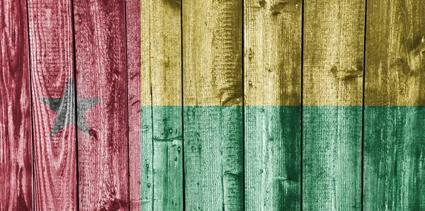 Flag of Guinea-Bissau on weathered wood — Stock Photo, Image