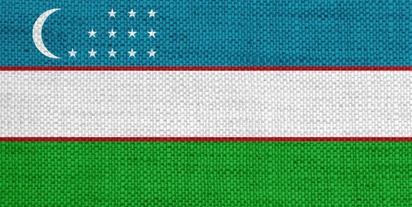 Bandeira do Uzbequistão em linho velho — Fotografia de Stock