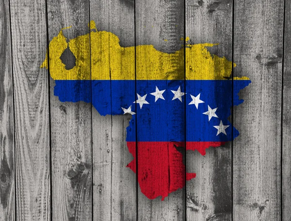 Mapa y bandera de Venezuela sobre madera envejecida —  Fotos de Stock