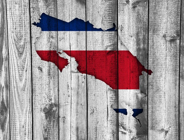 Map and flag of Costa Rica on weathered wood — Stock Photo, Image