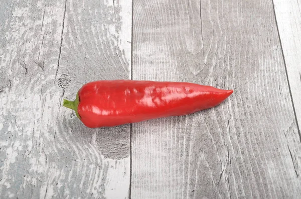 Red bell pepper on wood — Stock Photo, Image