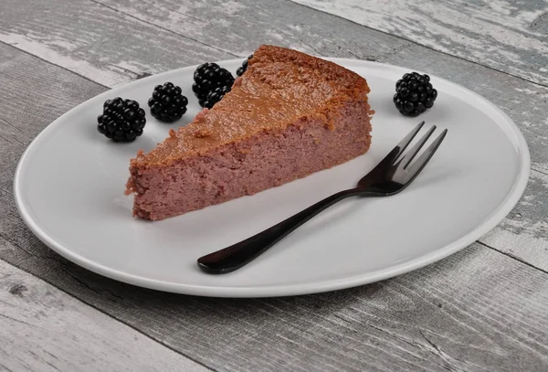 Cheesecake with blackberry on white plate — Stock Photo, Image