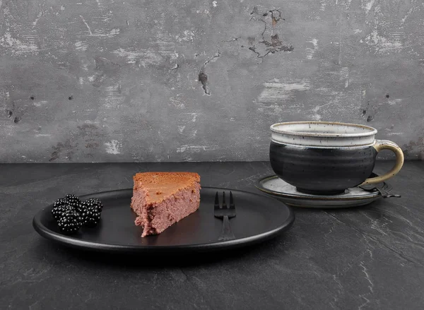 Cheesecake with blackberry on shale — Stock Photo, Image