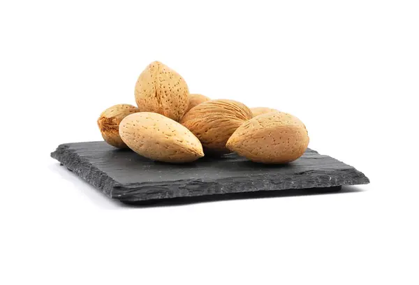 Almonds on shale isolated — Stock Photo, Image