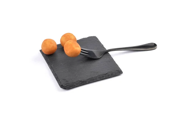 Marzipan potatoes on shale board — Stock Photo, Image