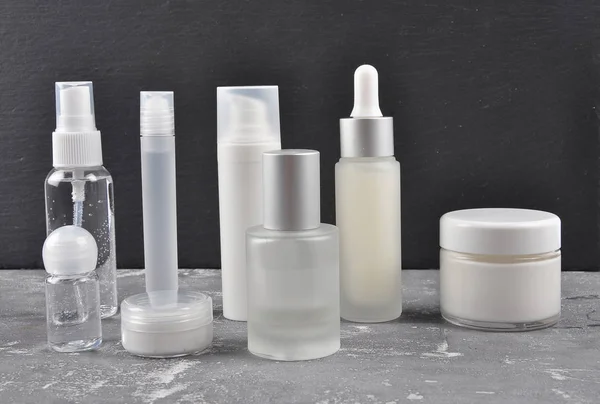Cosmetic products on concrete — Stock Photo, Image