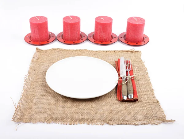 Christmassy table setting with burlap and candles — Stock Photo, Image