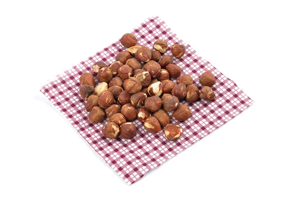 Hazelnuts on cloth and white — Stock Photo, Image