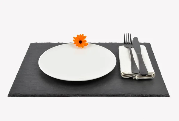 Common marigold and table setting on slate isolated — Stock Photo, Image