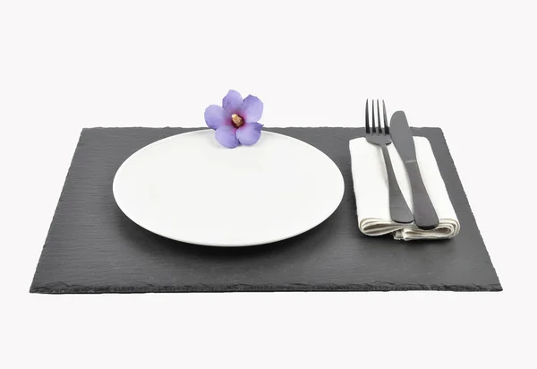 Hibiscus and table setting on slate isolated — Stock Photo, Image