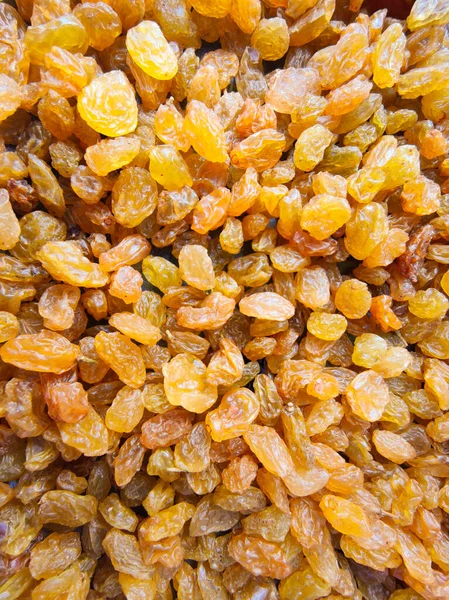 Tatlı, hafif, kurutulmuş üzümlerin arka planı.