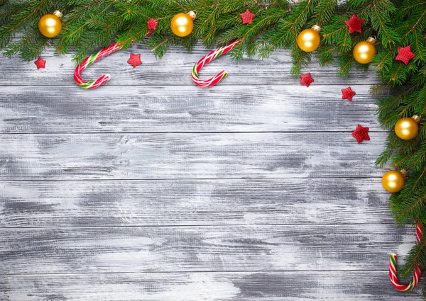 Christmas fir tree on wooden background — Stock Photo, Image