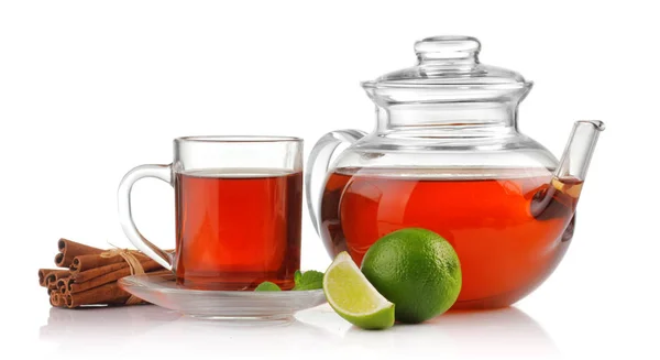 Tea cup, teapot with fresh mint, lime and cinnamon isolated — Stock Photo, Image