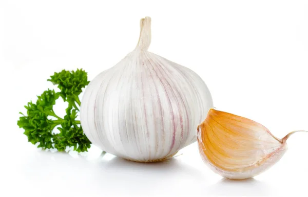 Garlic and parsley leaves isolated on white — Stock Photo, Image